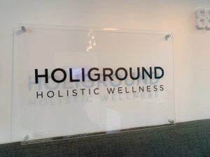 Custom acrylic office sign printed by Overflow Print, Holiground Holistic Wellness