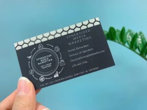 Foil business card with silver foil and spot UV, printed by Overflow Print — Synergized Media Marketing