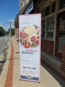 X-banner stand printed by Overflow Print, Blackened Salmon